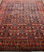 Persian Bijar blue ground rug with repeating Herati design,