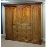 Victorian mahogany wardrobe, enclosed by four arched panelled doors, hanging space to either side,