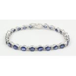 Oval sapphire and diamond bracelet stamped 18k Condition Report <a href='//www.