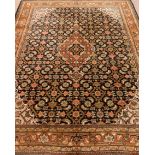 Persian Bijar blue ground rug with heratti motifs,
