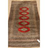 Persian finely knotted Bokhara rug, part silk,