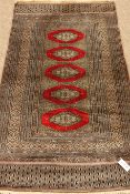 Persian finely knotted Bokhara rug, part silk,