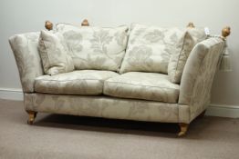 Two seat Knoll drop end sofa upholstered in floral patterned fabric cover,