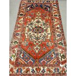 Persian Bakhtiar hand knotted rug, central pole medallion, red ground,