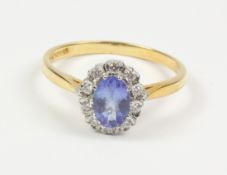 Tanzanite and diamond cluster gold ring hallmarked 18ct Condition Report <a