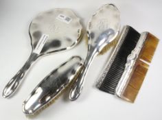 Silver four piece dressing table set Chester 1914 and another comb Condition Report