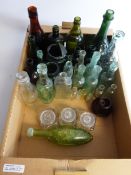 Collection of clear, green & brown glass bottles including Schweppe & Co Torpedo,