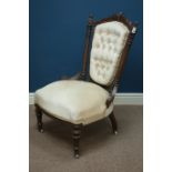 Victorian walnut nursing chair upholstered in beige buttoned fabric,