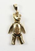 Gold articulated teddy bear pendant set with rubies,