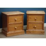 Pair pine two drawer bedside chests, W56cm, H63cm,
