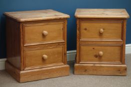 Pair pine two drawer bedside chests, W56cm, H63cm,