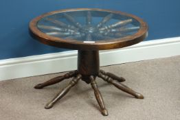 Stained oak ship's wheel coffee table with inset glass top, D64cm,