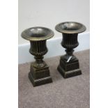 Pair small Victorian style Campana bronze finish cast iron urns on plinths, D29cm,