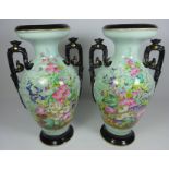 Pair of late 19th Century continental urn shaped vases with hand painted decoration,