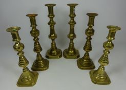 Large pair of brass candlesticks and two pairs of Queen of diamonds type brass candlesticks