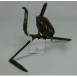 Bronze sculpture of a wren on branch by Patricia Northcroft,