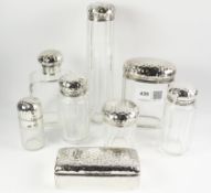 Late Victorian seven piece cut crystal dressing table set with beaten silver fittings London 1895