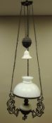 Late 19th early 20th Century 'rise and fall' centre oil lamp with Art Nouveau decoration