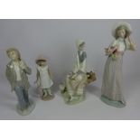 Lladro figure of a seated woman and three Nao figures (4) Condition Report <a