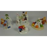 Four Coalport Snowman figures - limited edition 'The Merry Trio', 'Building The Snowman',