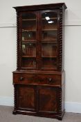 Victorian mahogany secretaire bookcase enclosed by arched glazed doors, barley twist pilasters,