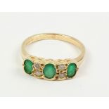 Emerald and diamond gold ring hallmarked 9ct Condition Report <a href='//www.