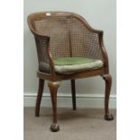20th century walnut bergere armchair with ball and claw feet Condition Report