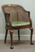 20th century walnut bergere armchair with ball and claw feet Condition Report