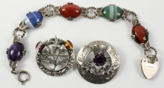 Two Scottish silver brooches set with cornelian and amethyst and a similar hardstone bracelet all