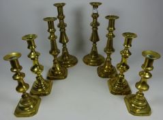 Large pair of brass candlesticks and three other similar graduating pairs (8) Condition