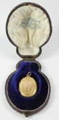 Gold locket, bright cut decoration hallmarked 14ct approx 8.