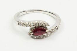 Ruby and Diamond white gold cross-over white ring hallmarked 18ct Condition Report