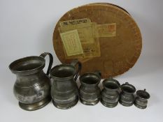 Matched set of Victorian graduating pewter measuring jugs and a Vintage hat box