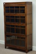 Early 20th century four sectional oak bookcase enclosed by hinged sliding glazed doors, W87cm,