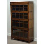 Early 20th century four sectional oak bookcase enclosed by hinged sliding glazed doors, W87cm,