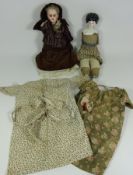 Bisque head doll with jointed leather body and a porcelain head doll (2) Condition Report