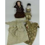 Bisque head doll with jointed leather body and a porcelain head doll (2) Condition Report