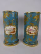 Pair of small Victorian cylindrical vases painted with landscapes on blue & gilt ground, painted no.