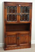Old Charm oak linen fold side cabinet enclosed by two lead glazed doors, W92cm, H153cm,