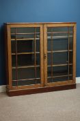 Early 20th century oak bookcase enclosed by two astragal glazed doors by Robson and Co Newcastle,