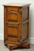 Quality reproduction oak revolving cabinet, two fielded panelled doors, W42cm, H84cm,