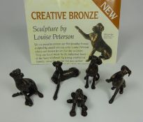 Five bronze great Dane sculptures by Louise Peterson, each signed L.