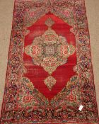 Old Persian Kerman rug, red ground with floral central pole medallion and border,