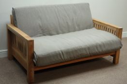 Futon Company 'Oke' two seat oak framed sofa bed with upholstered loose cushion,
