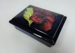 Moorcroft Hibiscus pattern rectangular lidded dish, W12.