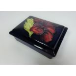 Moorcroft Hibiscus pattern rectangular lidded dish, W12.