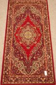 Grosvenor Persian Wilton red ground rug,
