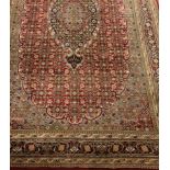 Persian Bidjar maroon ground with pale blue rug carpet, repeating Heratti motif field,