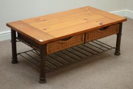 Polished pine rectangular coffee table with sliding baskets and undertier below, 122cm x 67cm,