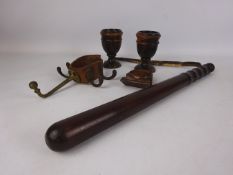 Pair of Lignum Vitae turned cups, a truncheon with leather strap,